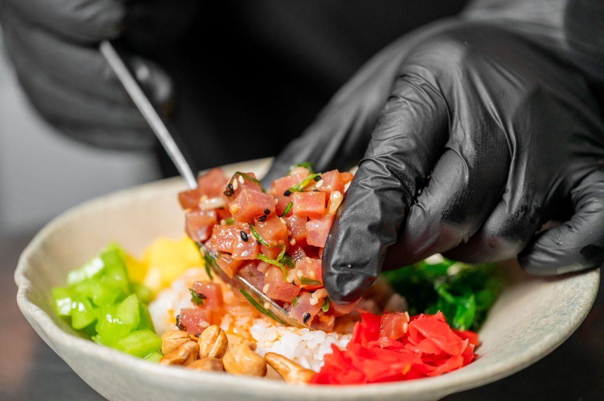 Chef preparing a fresh poke bowl
